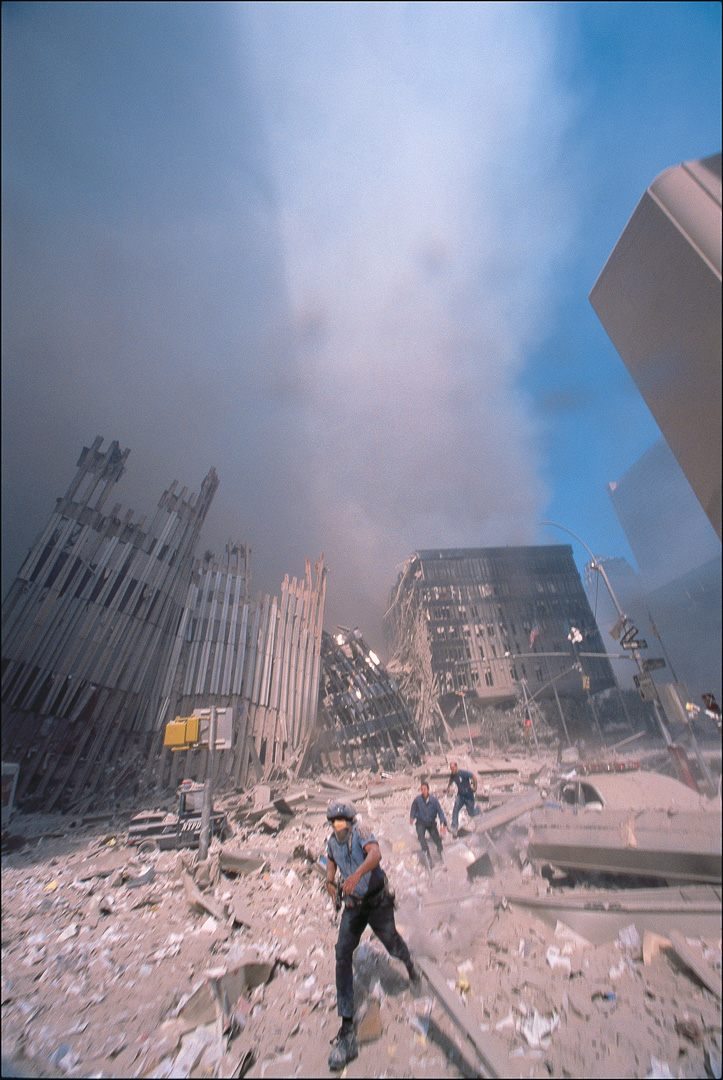 Armed NYPD run from WTC after 1st tower collapse