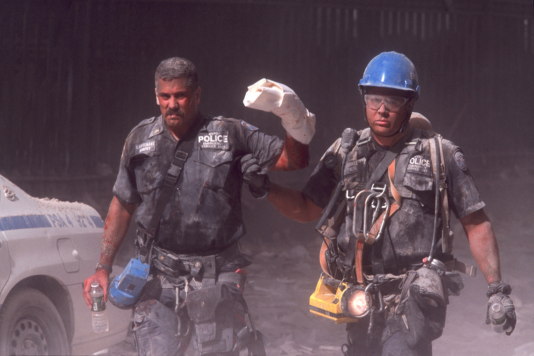 An ESU officer assists his injured Leiutenant after tower collapse