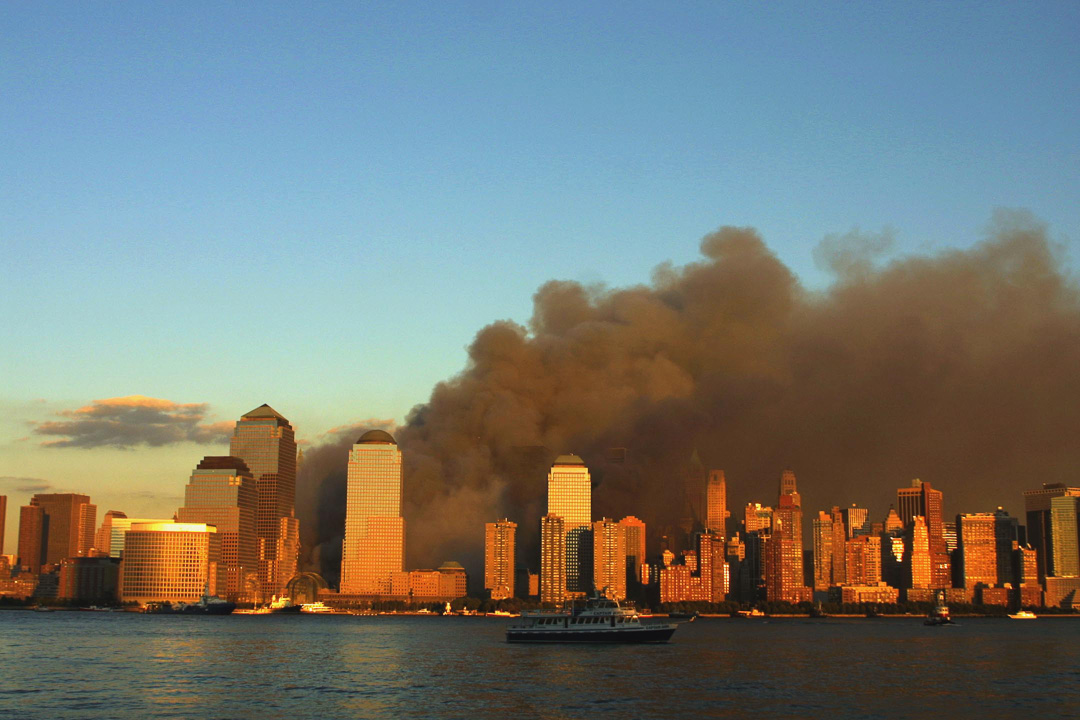 Smoke pours from WTC site as seen from Jersey Ciy, NJ