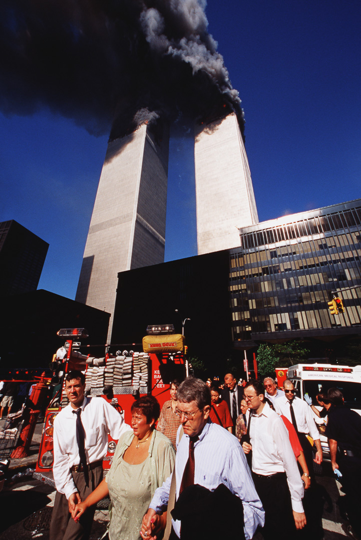Workers evacuate burning twin towers
