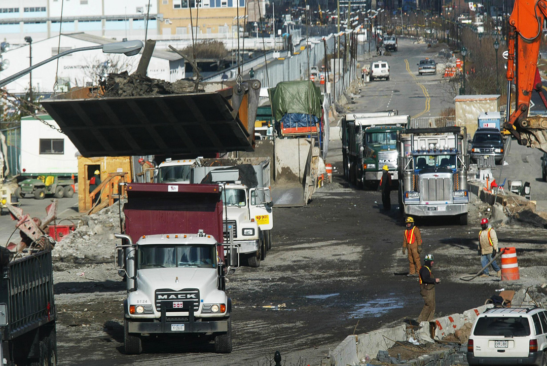 Debris trucked from Ground Zero is loaded on barges