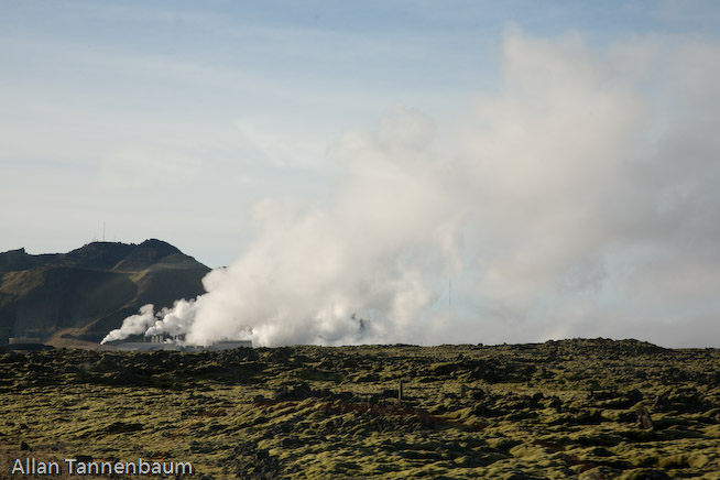 Steam rises form both a geothermal power plant and the Blue Lagoon hot springs, world renowned as a bathing spa.///