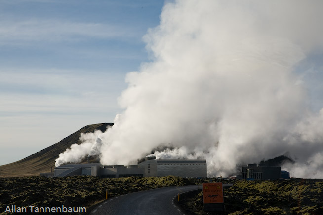 Steam rises form both a geothermal power plant and the Blue Lagoon hot springs, world renowned as a bathing spa.///