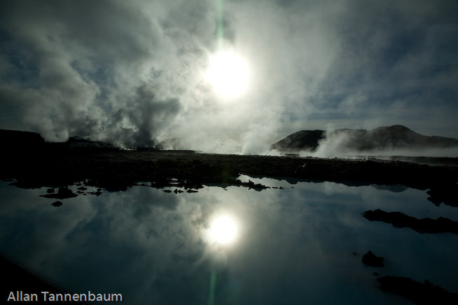 Steam rises form both a geothermal power plant and the Blue Lagoon hot springs, world renowned as a bathing spa.///