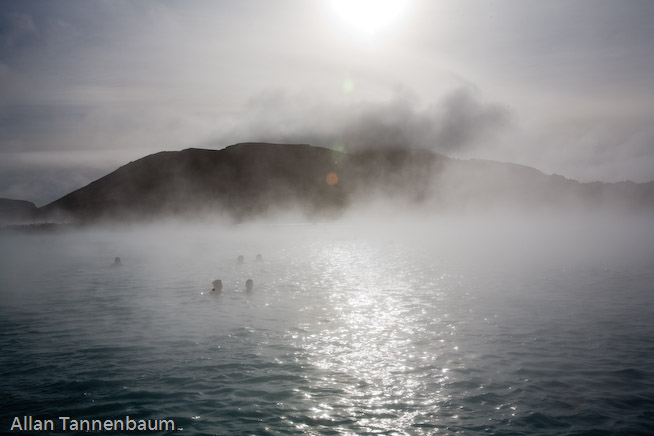 Steam rises form both a geothermal power plant and the Blue Lagoon hot springs, world renowned as a bathing spa.///