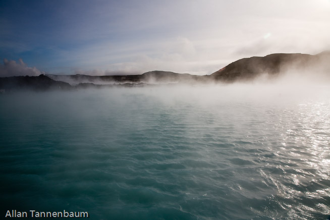 Steam rises form both a geothermal power plant and the Blue Lagoon hot springs, world renowned as a bathing spa.///