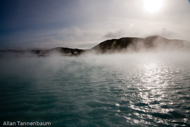 Steam rises form both a geothermal power plant and the Blue Lagoon hot springs, world renowned as a bathing spa.///