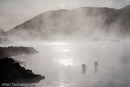 Steam rises form both a geothermal power plant and the Blue Lagoon hot springs, world renowned as a bathing spa.///