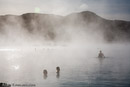 Steam rises form both a geothermal power plant and the Blue Lagoon hot springs, world renowned as a bathing spa.///