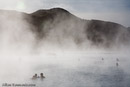 Steam rises form both a geothermal power plant and the Blue Lagoon hot springs, world renowned as a bathing spa.///